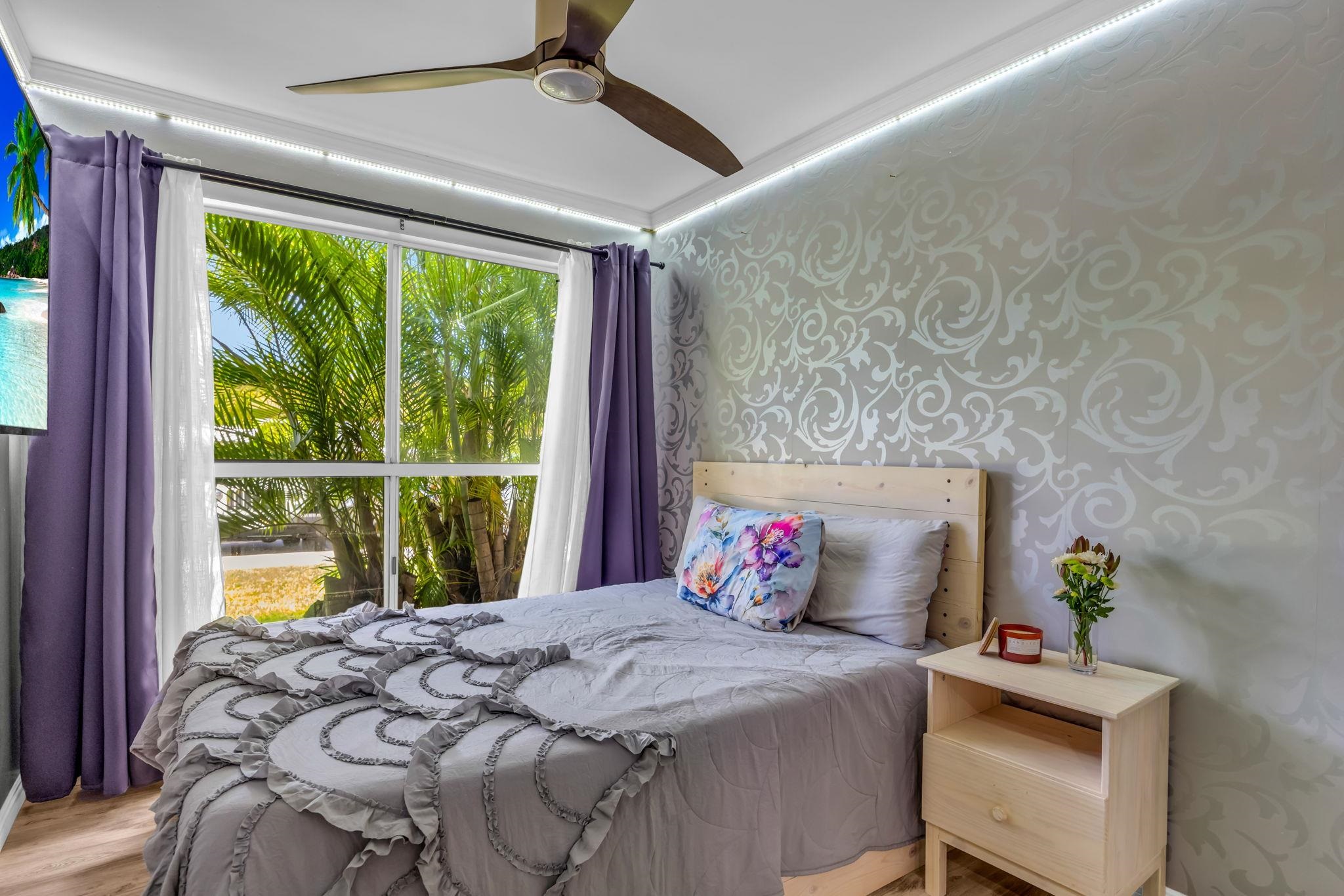 160 Keonekai Road, Unit 13102 Kihei, HI 96753 - Photo 13 of 36 a bedroom with a bed and a window