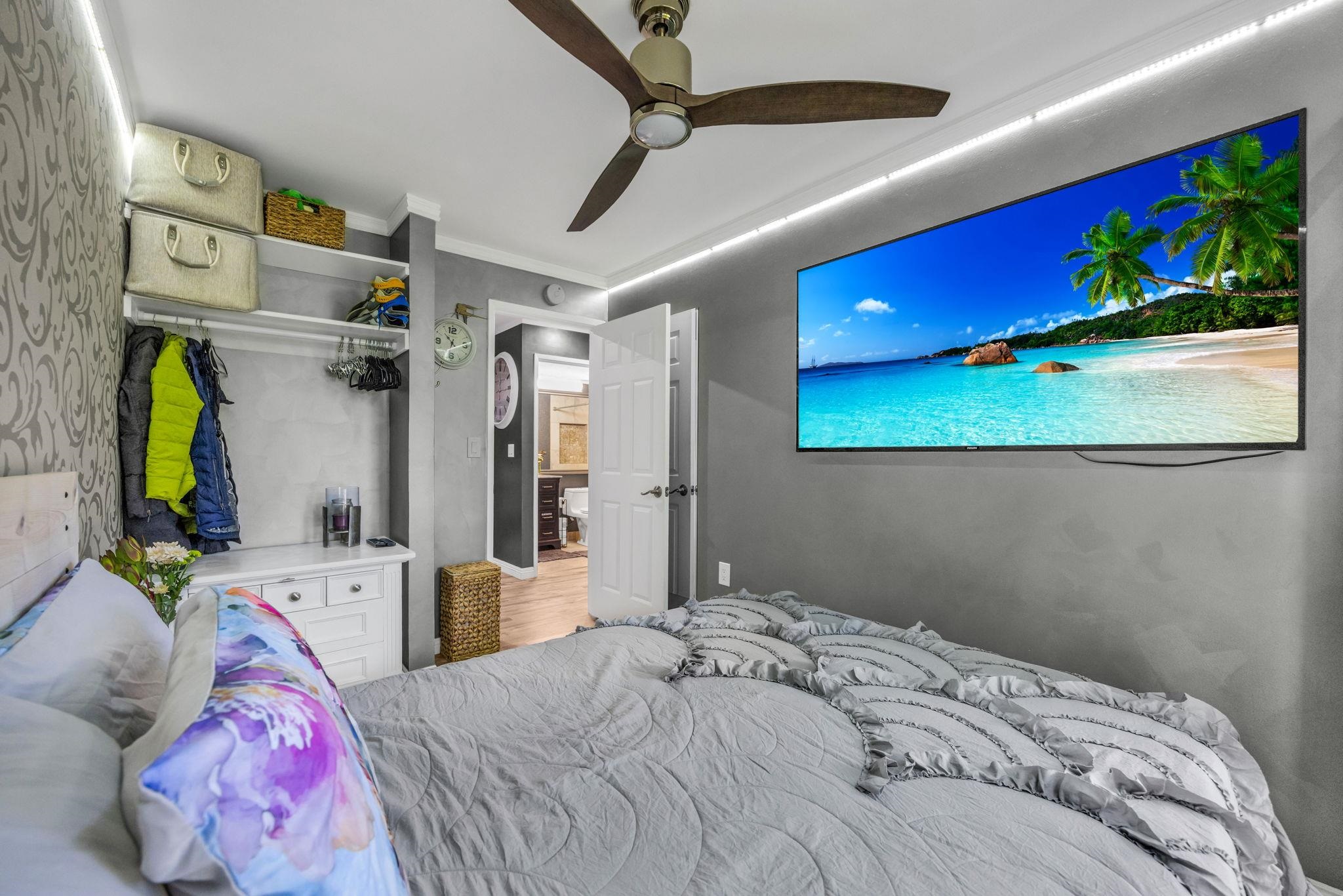 160 Keonekai Road, Unit 13102 Kihei, HI 96753 - Photo 16 of 36 a bedroom with a bed and a couch