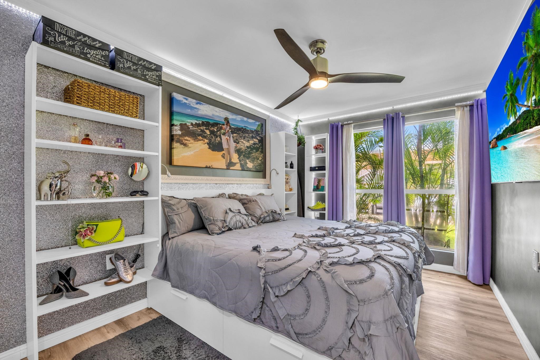 160 Keonekai Road, Unit 13102 Kihei, HI 96753 - Photo 19 of 36 a bedroom with a bed and a window