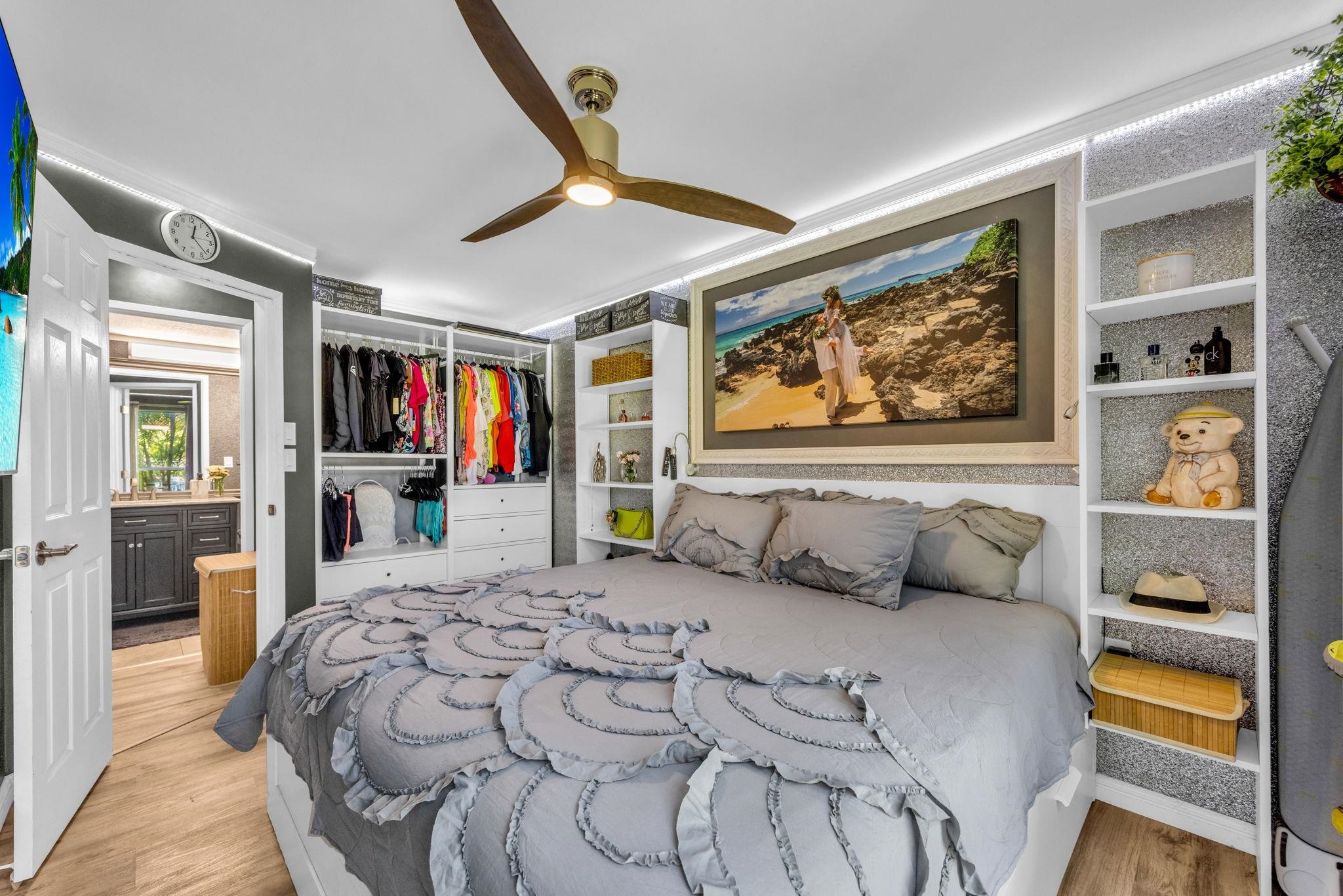 160 Keonekai Road, Unit 13102 Kihei, HI 96753 - Photo 21 of 36 a bedroom with a bed and a flat screen tv