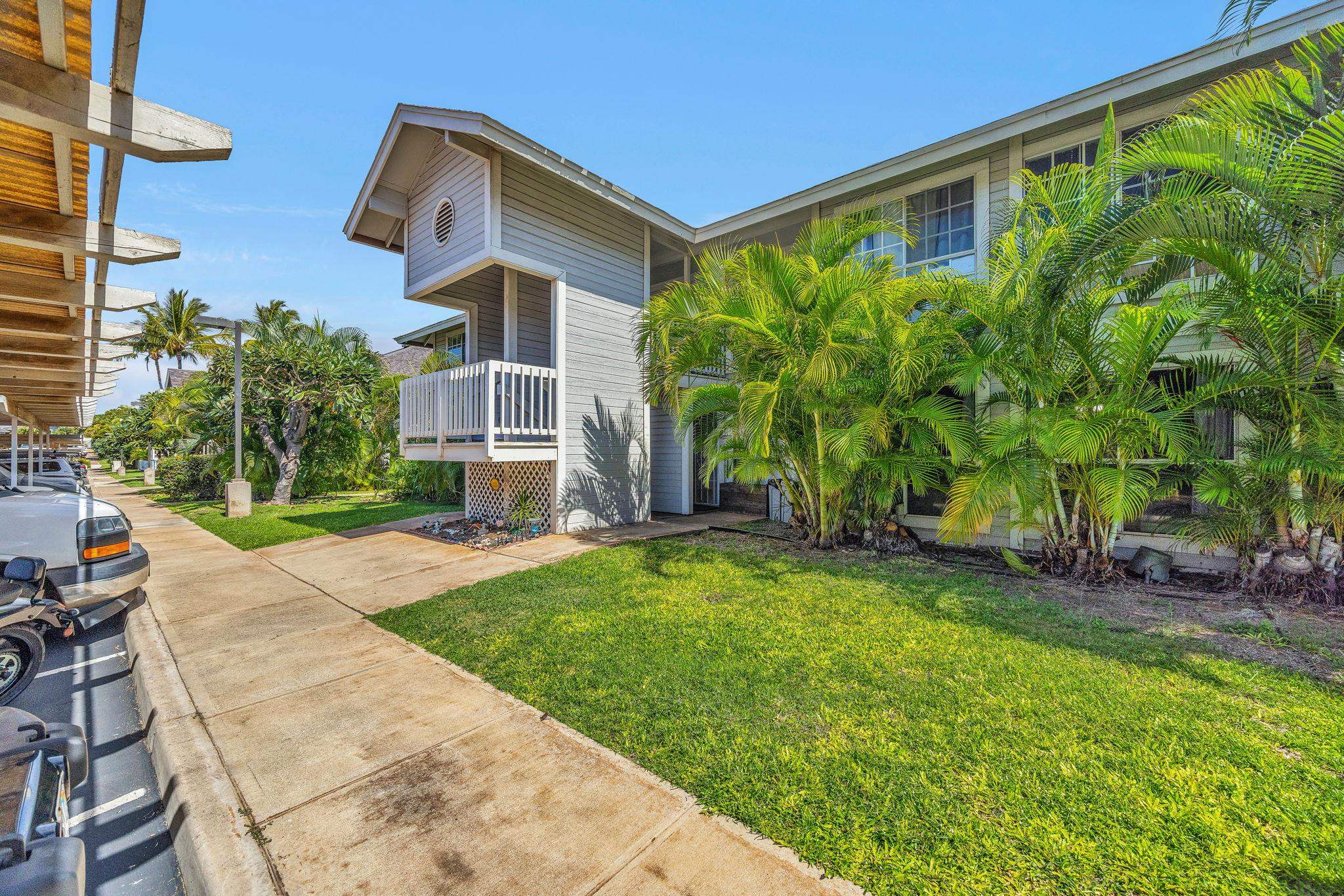 160 Keonekai Road, Unit 13102 Kihei, HI 96753 - Photo 23 of 36 front view of a house with a yard