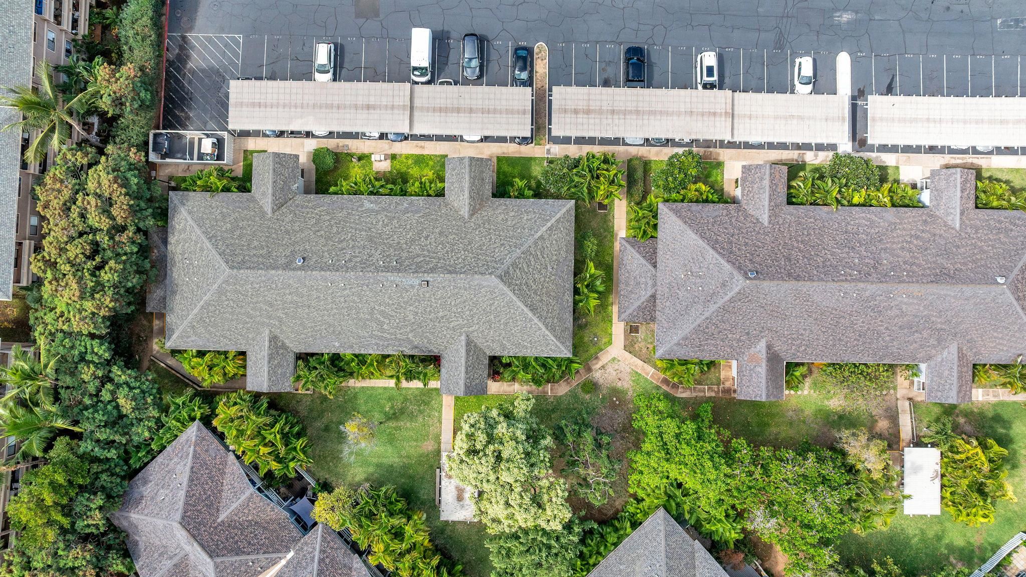 160 Keonekai Road, Unit 13102 Kihei, HI 96753 - Photo 33 of 36 an aerial view of a house with plants and large trees