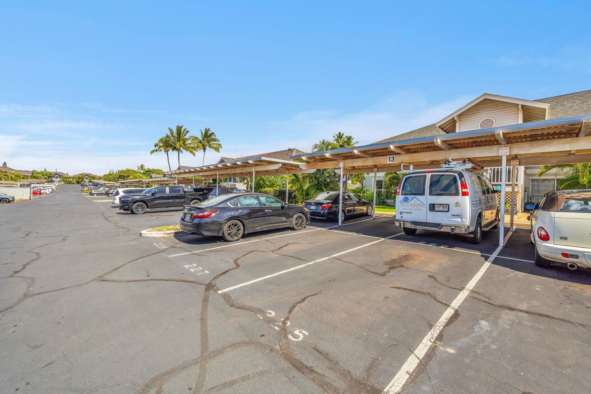 160 Keonekai Road, Unit 13102 Kihei, HI 96753 - Photo 34 of 36 a car parked on the side of a street