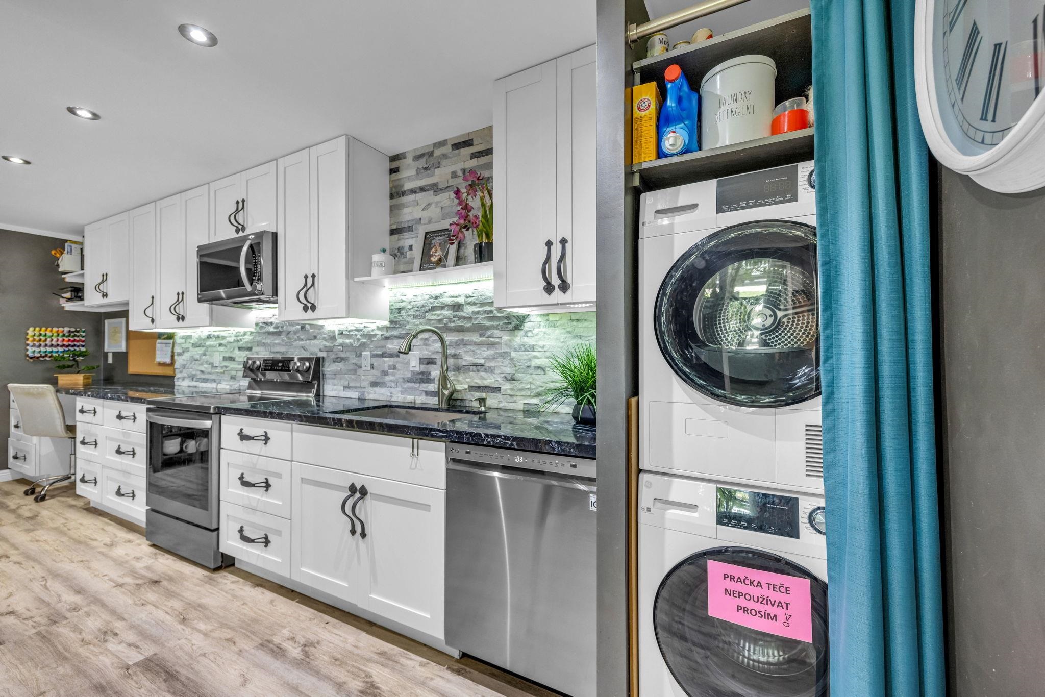 160 Keonekai Road, Unit 13102 Kihei, HI 96753 - Photo 7 of 36 a kitchen with stainless steel appliances granite countertop a stove and a sink