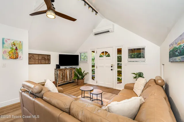 a view of a trees with yard in front of it