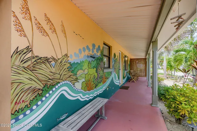 a large white kitchen with stainless steel appliances