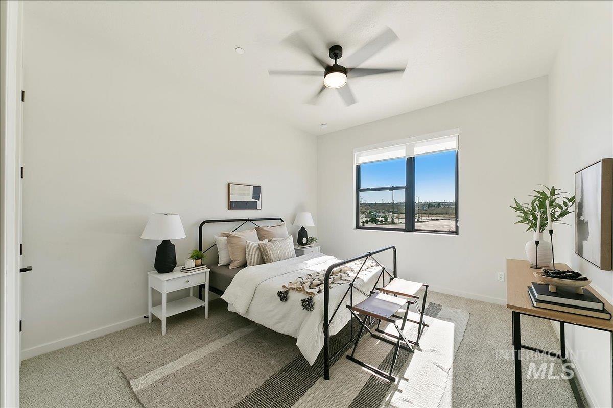 4430 East Haystack Street, Unit 109 Boise, ID 83716 - Photo 11 of 43 Bedroom featuring light carpet and a ceiling fan