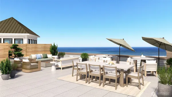 a view of a patio with dining table and chairs under an umbrella