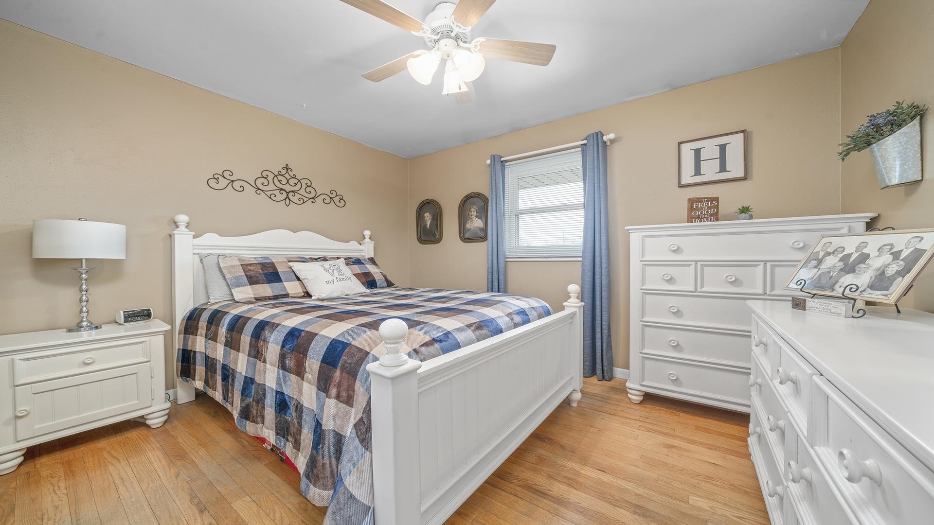6858 Ralph Road Rockford, IL 61109 - Photo 10 of 24 a bedroom with a bed and a chandelier