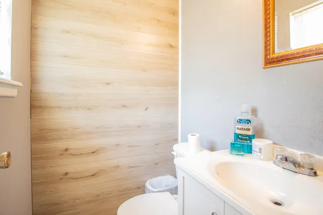 a bathroom with a sink a toilet and a shower