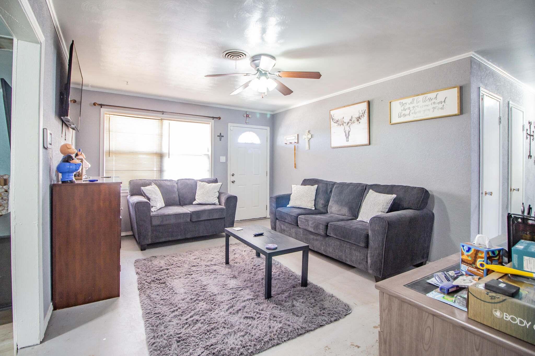 110 Ave T Levelland, TX 79336 - Photo 5 of 22 a living room with furniture and a chandelier