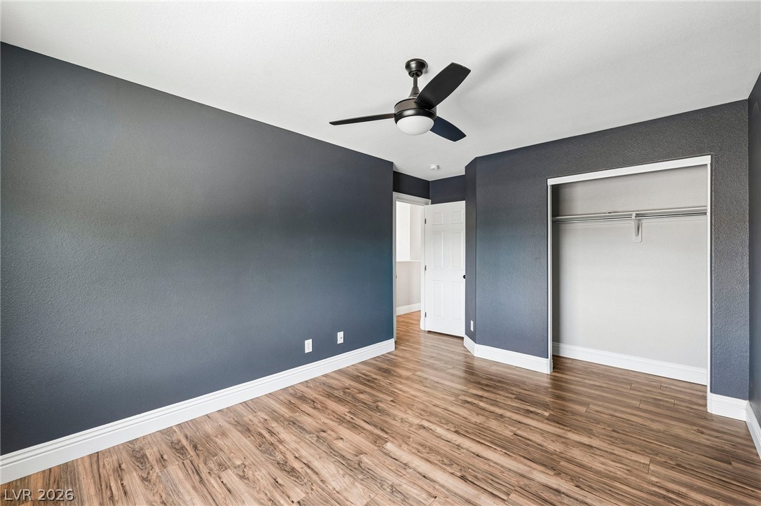 1176 Butternut Ranch Court Henderson, NV 89052 - Photo 27 of 60 Laminate flooring and a ceiling fan create a comfortable and modern atmosphere.