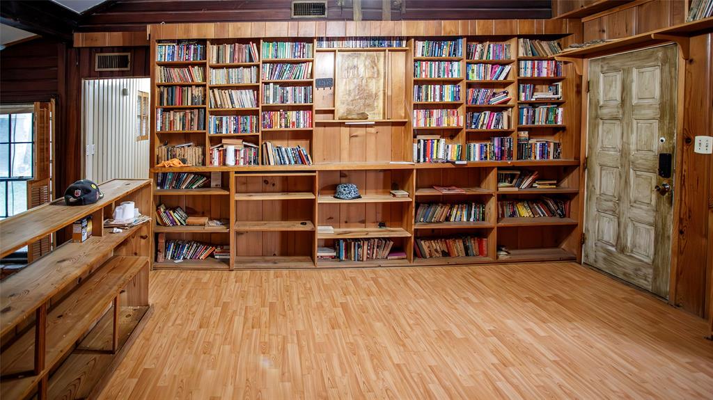902 West Main Street Olney, TX 76374 - Photo 6 of 24 a living room with fish tank and a bookshelf