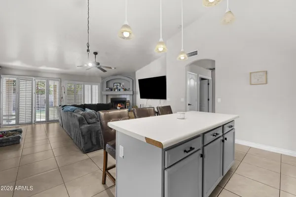 a kitchen with cabinets appliances a sink and a window