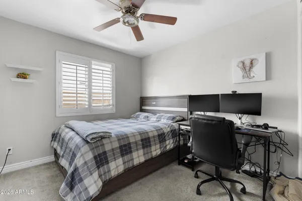 a white toilet sitting next to a bath tub and a shower