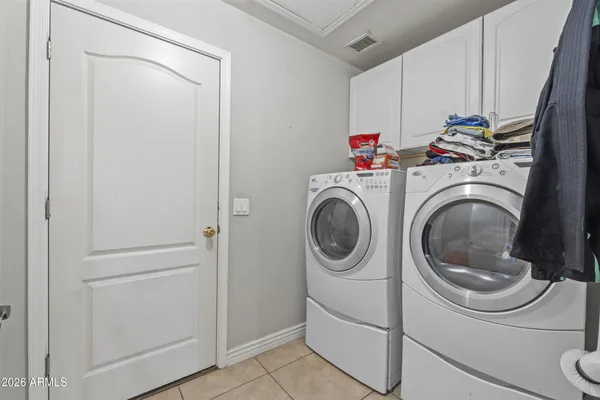 a bedroom with a bed and a desk