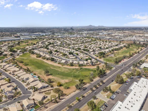 an aerial view of residential building and lake