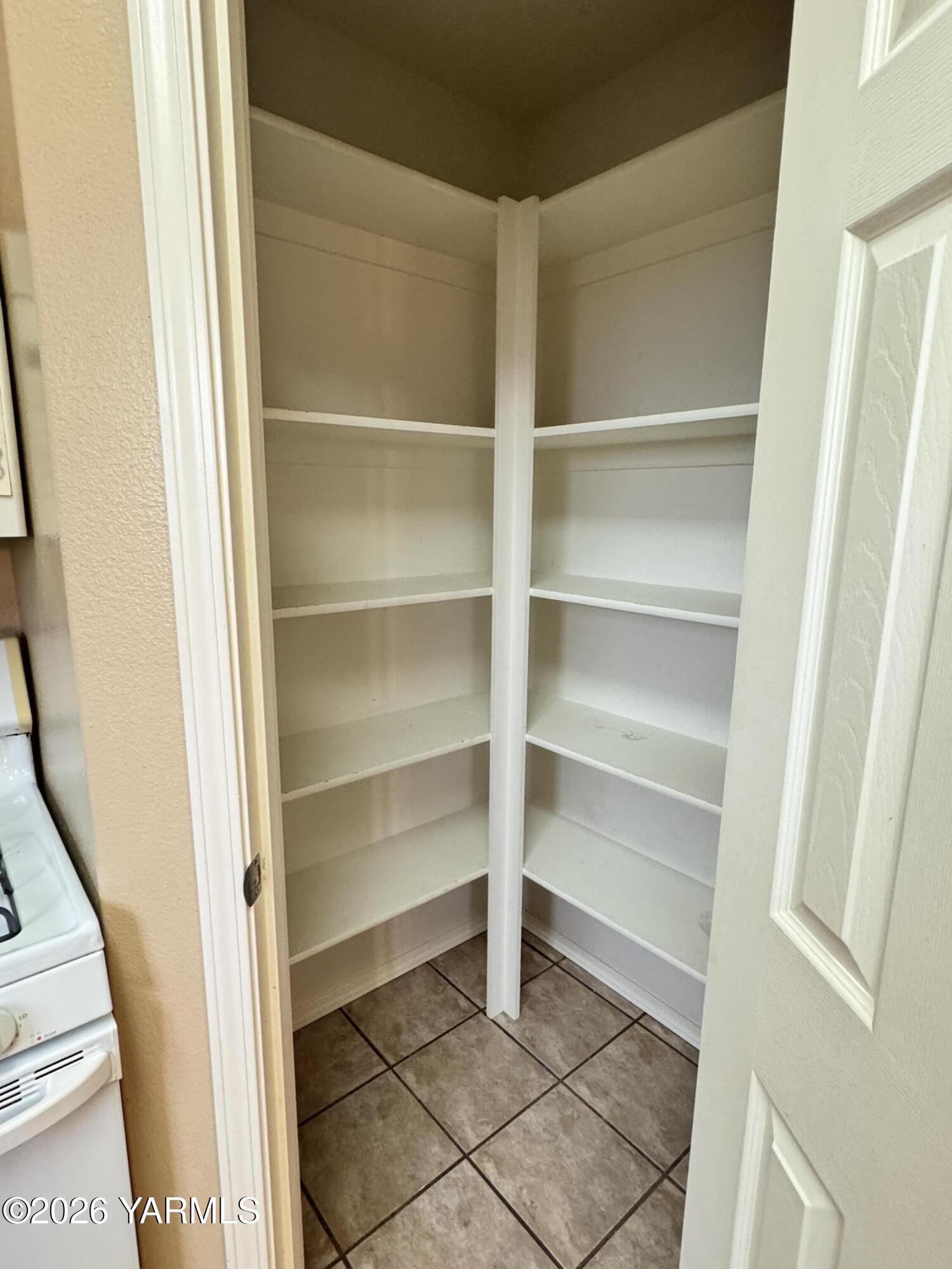 815 Jessica Court Grandview, WA 98930 - Photo 17 of 27 a storage room with a wooden floor