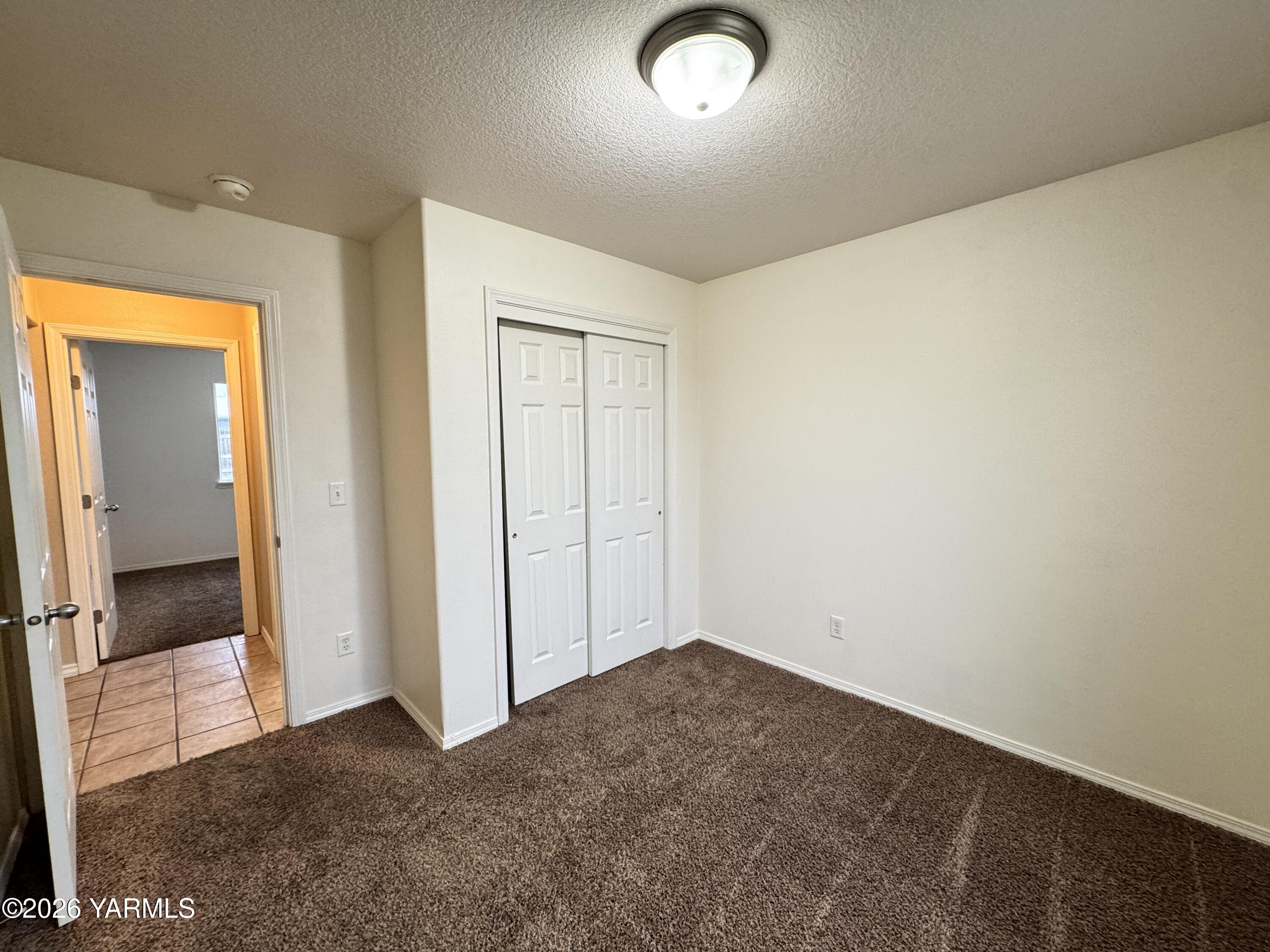 815 Jessica Court Grandview, WA 98930 - Photo 24 of 27 an empty room with closet
