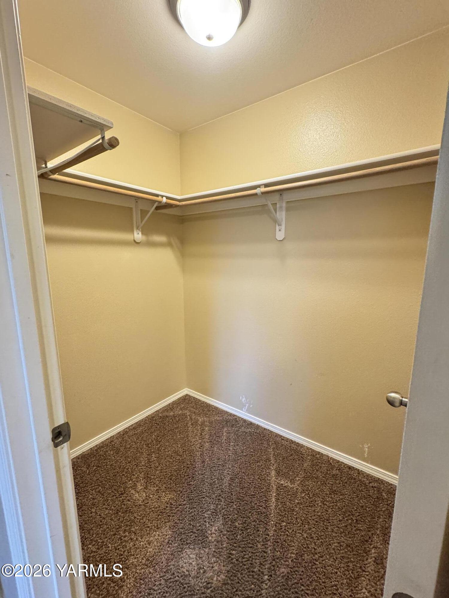 815 Jessica Court Grandview, WA 98930 - Photo 8 of 27 a view of small space with racks on the wall