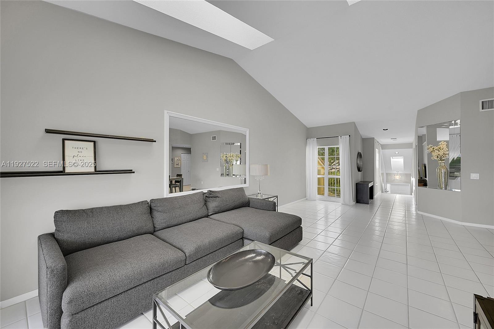 17317 Boca Club Boulevard, Unit 7 Boca Raton, FL 33487 - Photo 14 of 48 a living room with furniture and a couch