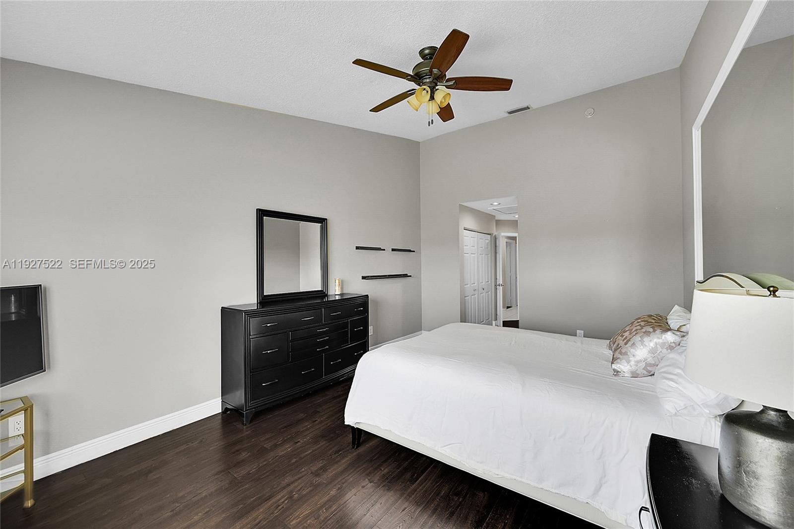 17317 Boca Club Boulevard, Unit 7 Boca Raton, FL 33487 - Photo 28 of 48 a bedroom with a bed and a dresser