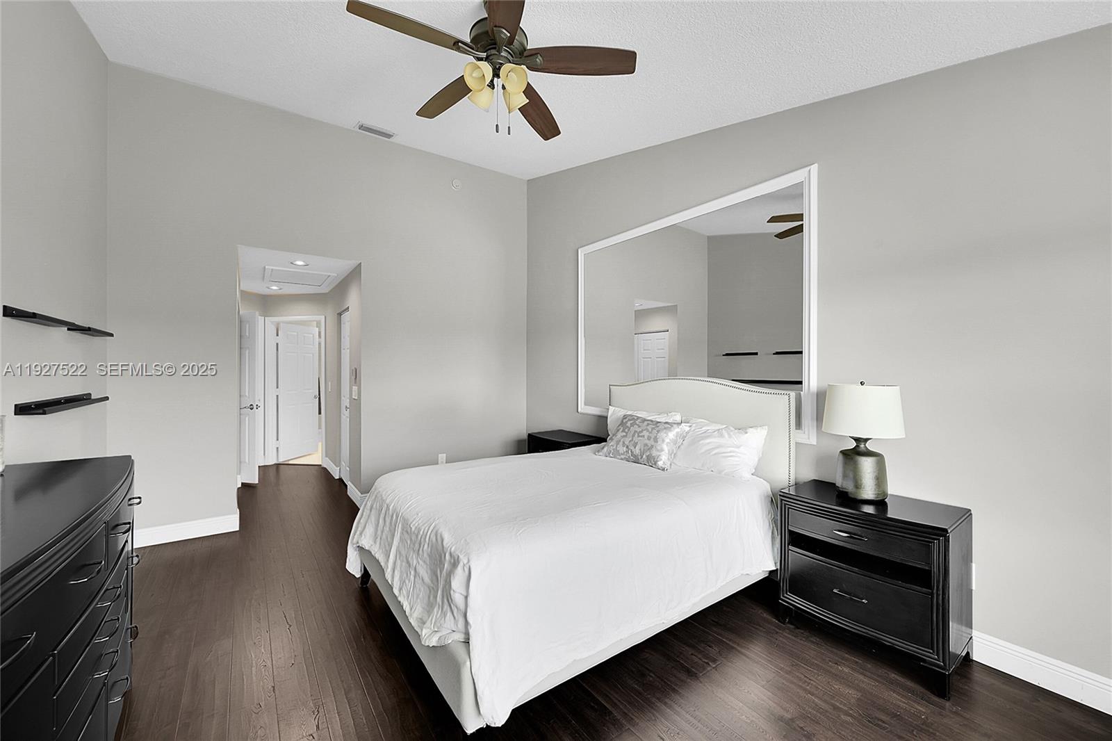 17317 Boca Club Boulevard, Unit 7 Boca Raton, FL 33487 - Photo 29 of 48 a bedroom with a bed and wooden floor