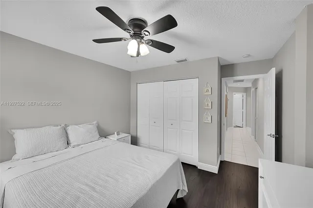 a bathroom with a toilet a sink and a mirror