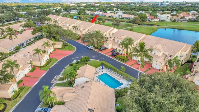 an aerial view of residential houses and outdoor space