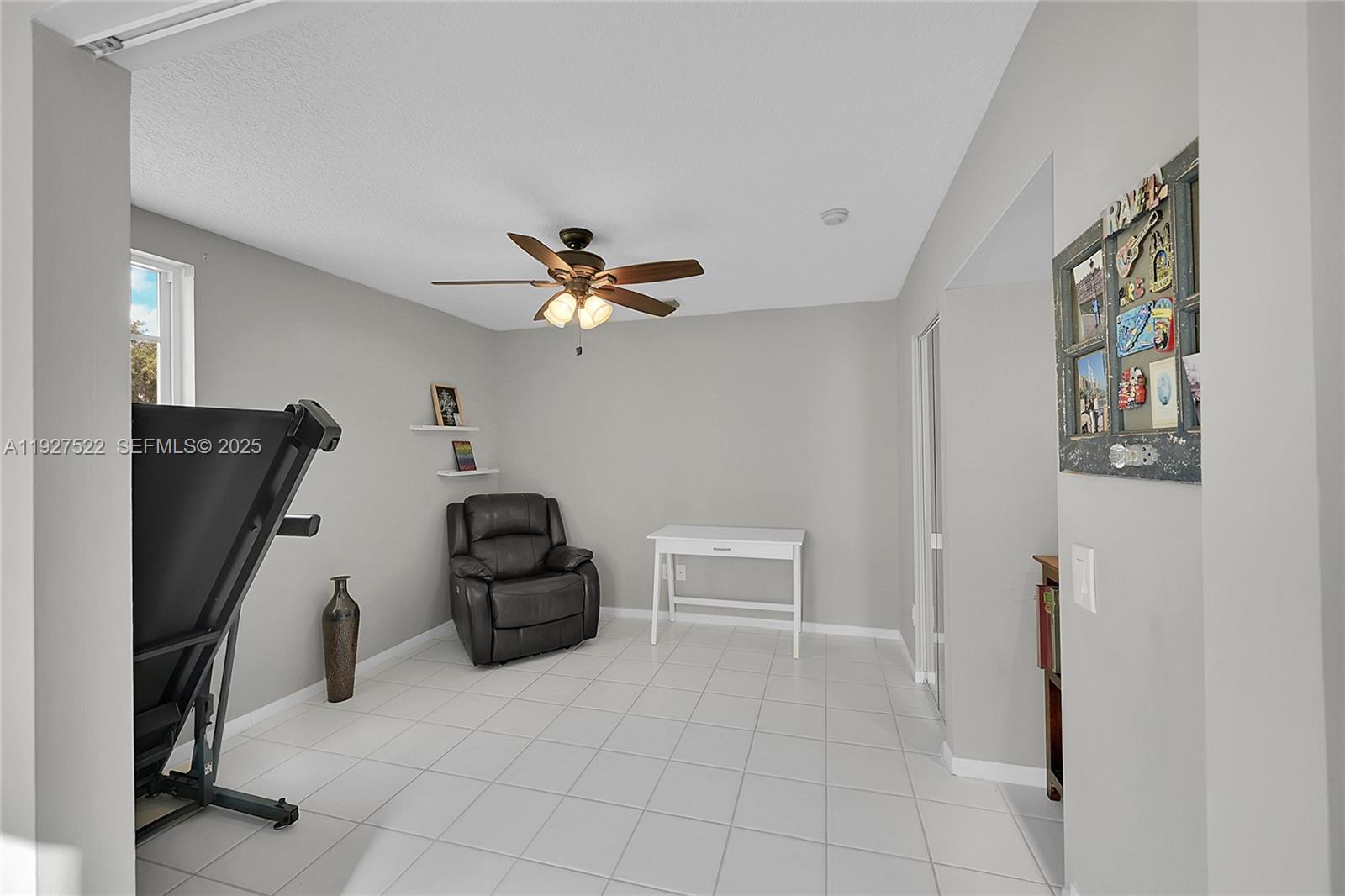 17317 Boca Club Boulevard, Unit 7 Boca Raton, FL 33487 - Photo 9 of 48 a bedroom with a bed and a chandelier