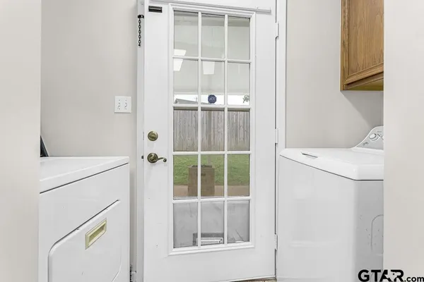 a utility room with dryer and washer