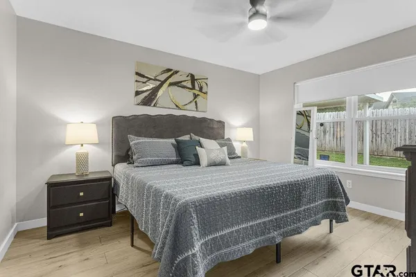 a bedroom with a bed and window