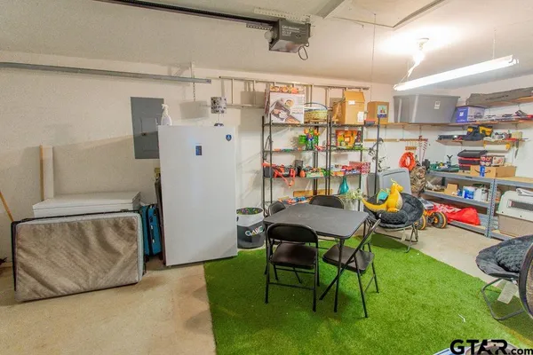 a view of a room with fridge and outdoor
