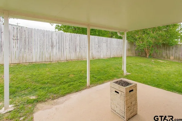 a view of a backyard with a garden and plants