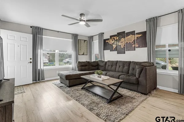 a living room with furniture and a large window