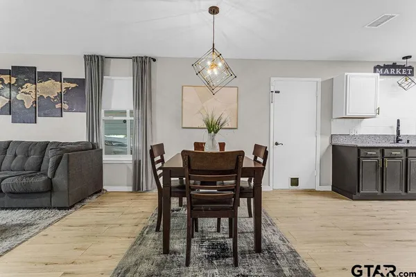a view of a dining room with furniture