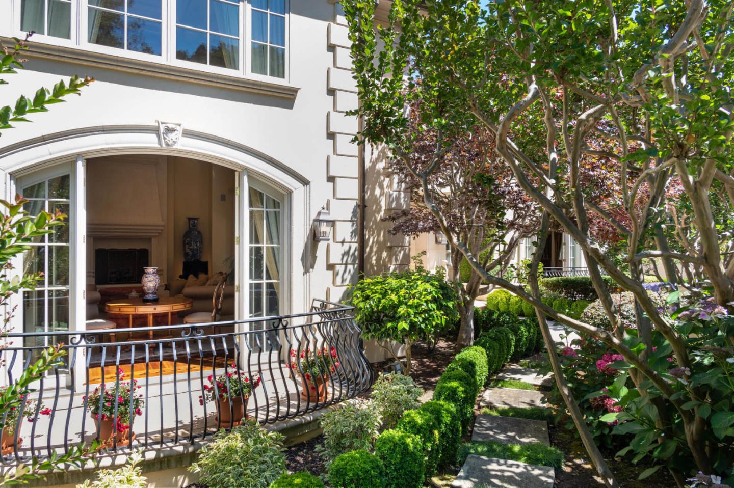 a view of a house with a flower garden
