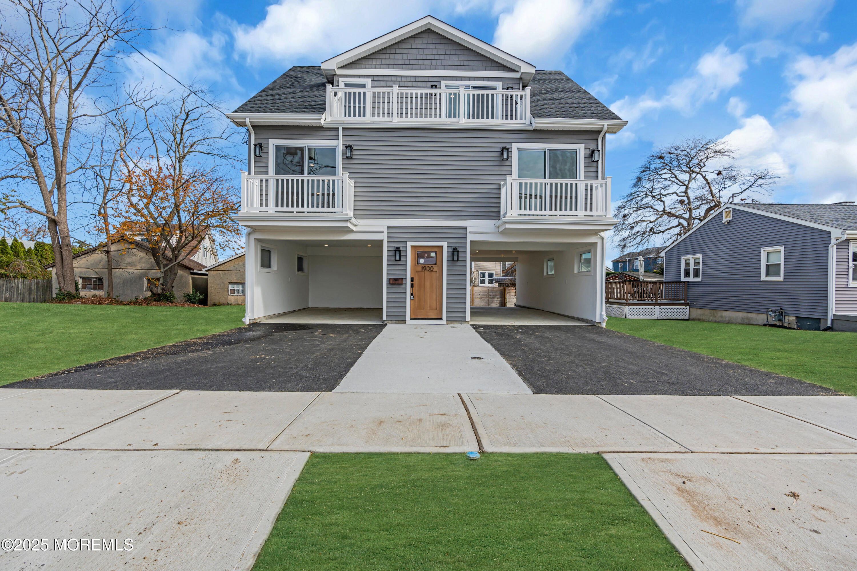 1900 Main Street Belmar, NJ 07719 - Photo 6 of 20 a front view of a house with a yard and garage