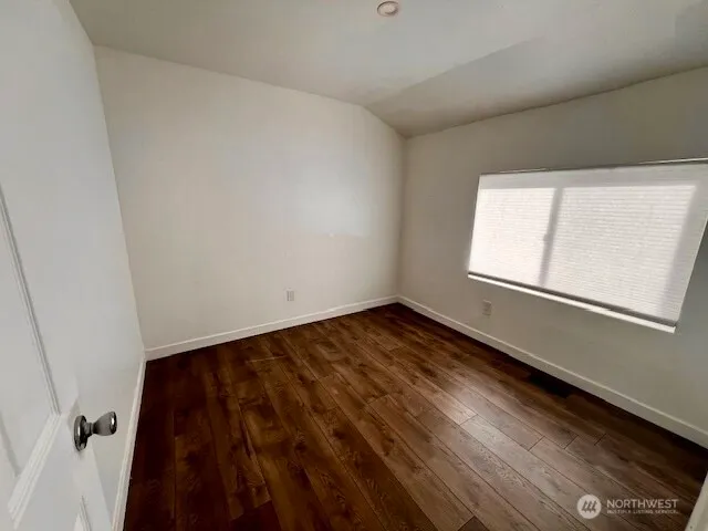 a view of a kitchen with a sink washer and dryer