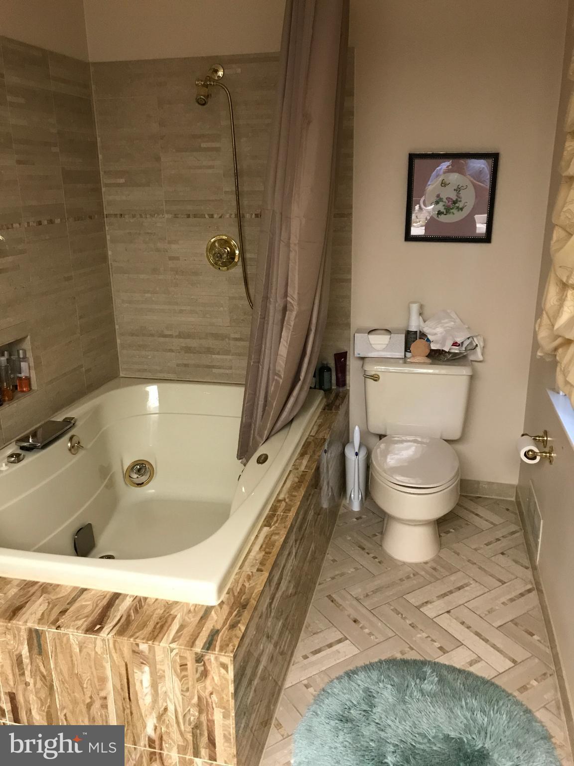 3311 Fallstaff Road Baltimore, MD 21215 - Photo 23 of 30 Master bath with marble whirlpool tub and shower