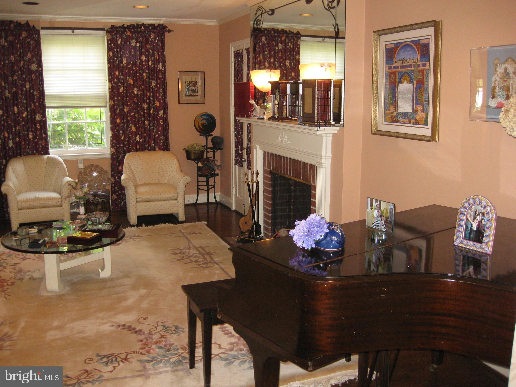 3311 Fallstaff Road Baltimore, MD 21215 - Photo 6 of 30 Formal living room with wood burning fireplace