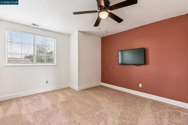 a bathroom with a sink a toilet a mirror and shower