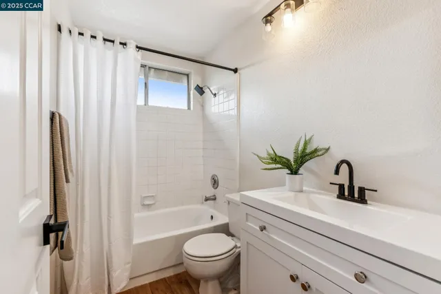 a view of a chairs and tables in the back yard of the house