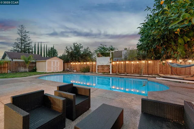 a view of a swimming pool with a patio