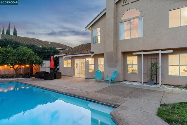 a view of a swimming pool with a seating space