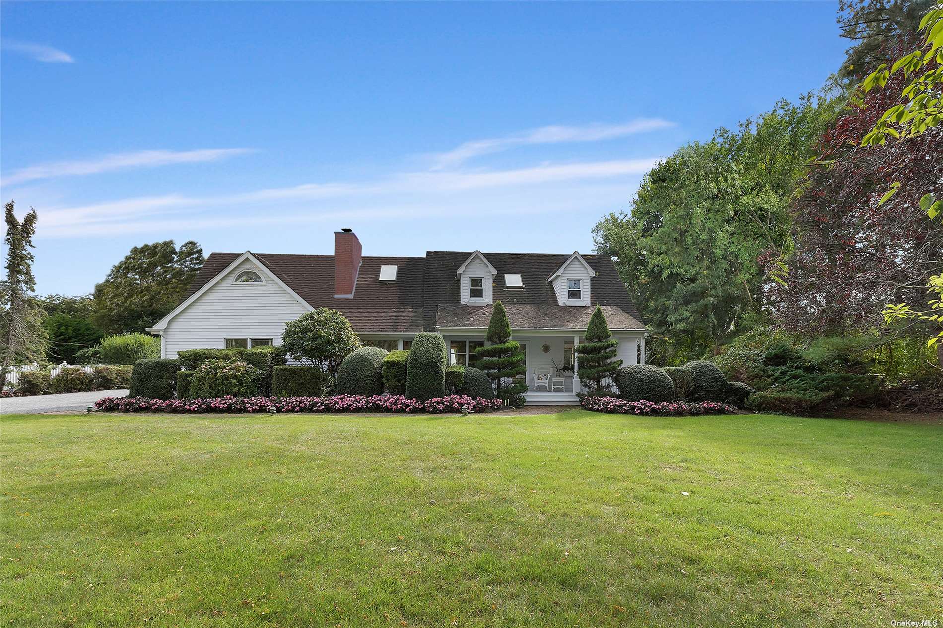 2 Old Mill Lane Remsenburg, NY 11960 - Photo 1 of 1 a front view of house with yard and green space