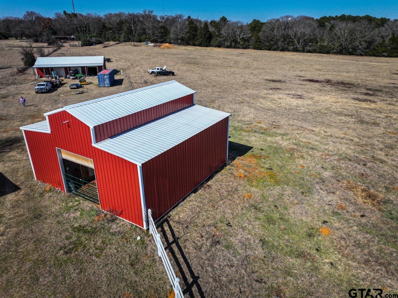 6820 Farm To Market Road 321 Tennessee Colony, TX 75861 - Photo 7 of 9 a view of a house with pool and a yard