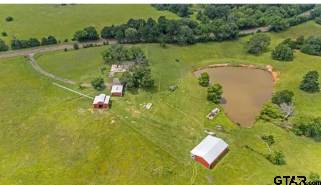 6820 Farm To Market Road 321 Tennessee Colony, TX 75861 - Photo 8 of 9 a view of a lake with a yard