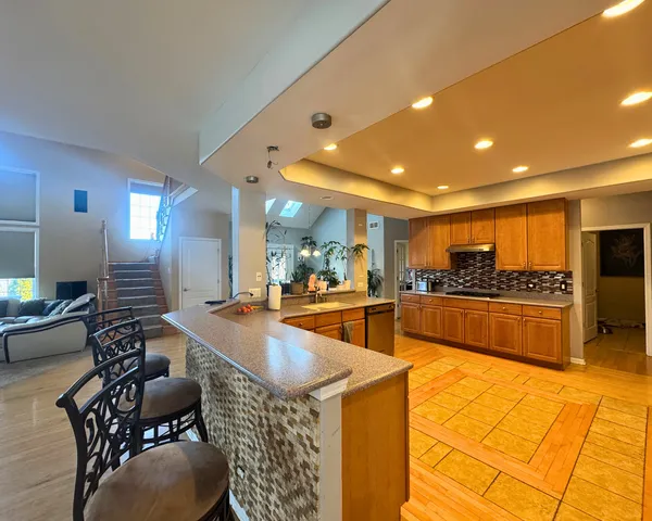 a view of a living room with furniture and a fireplace