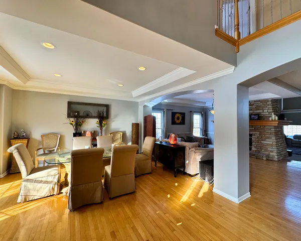 a living room with fireplace furniture and a table
